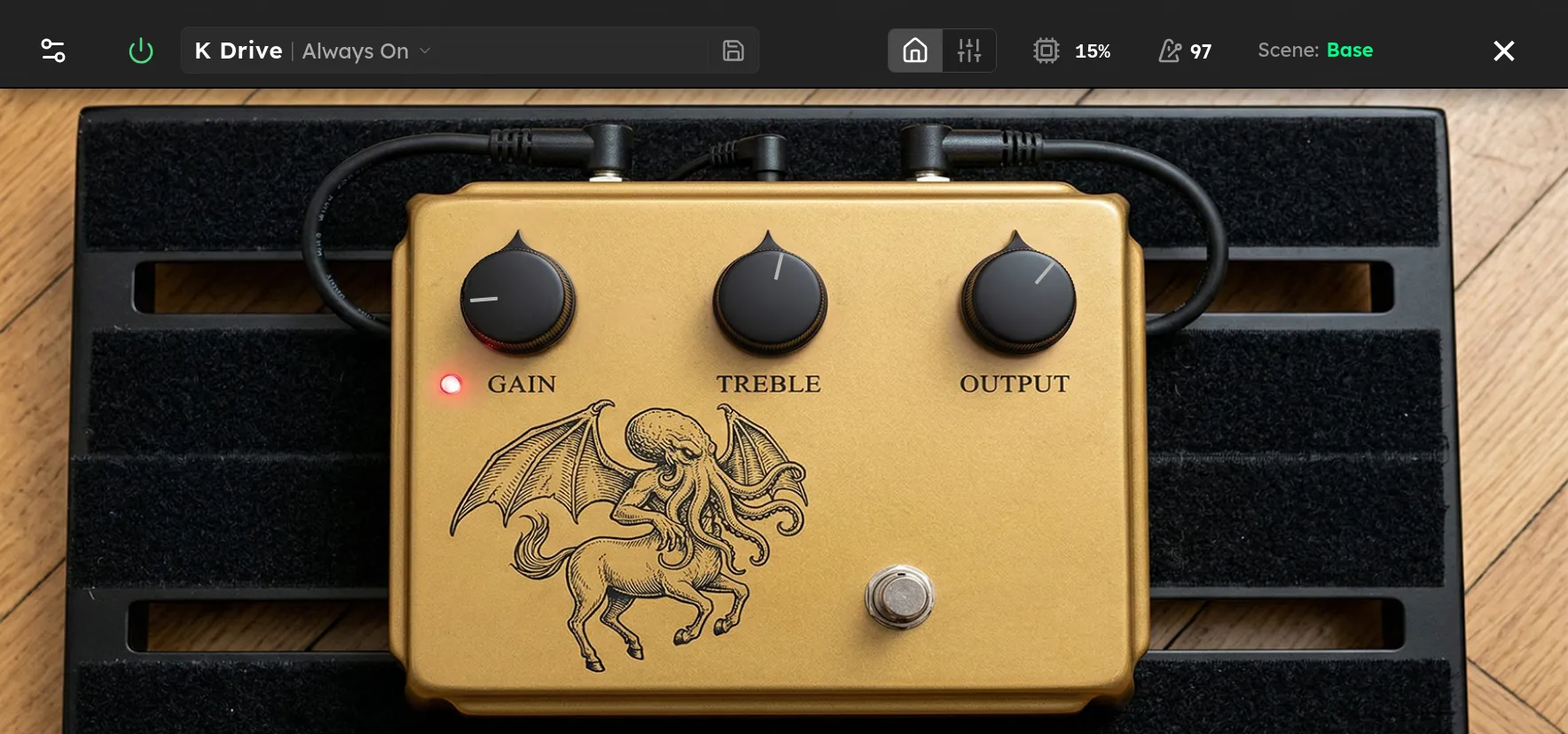 The K Drive device screen: Gain, Treble, Level, and Mode controls on the Axion display.
