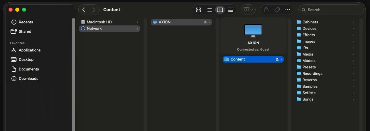 The Axion Content folder open on a computer, showing files being copied to the unit over the network.